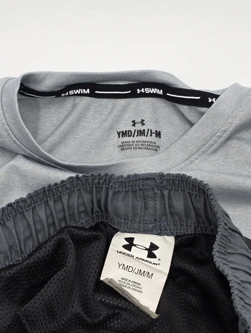 Under Armour boys' rashguard and swim trunks size M
